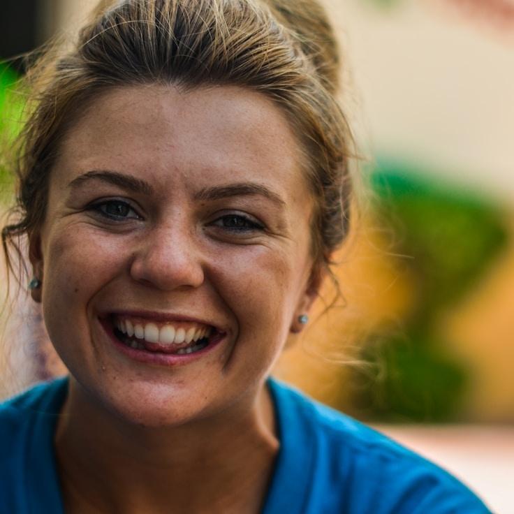 Alex Kim, Lead Design Curator at HortaVelisuna, reviewing corporate floral arrangements